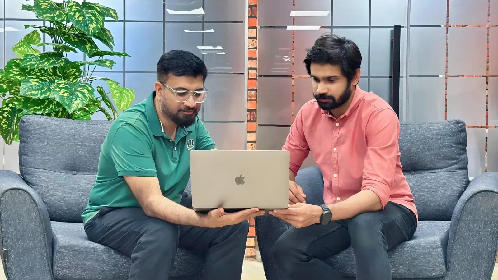 MomentoTech team reviewing work together